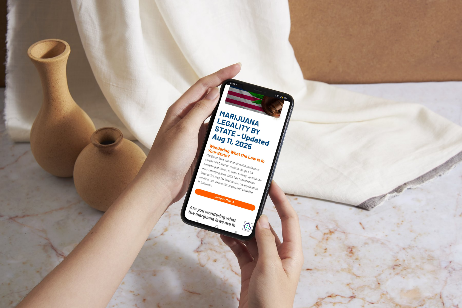 Person checking cannabis laws on a state website using a smartphone.