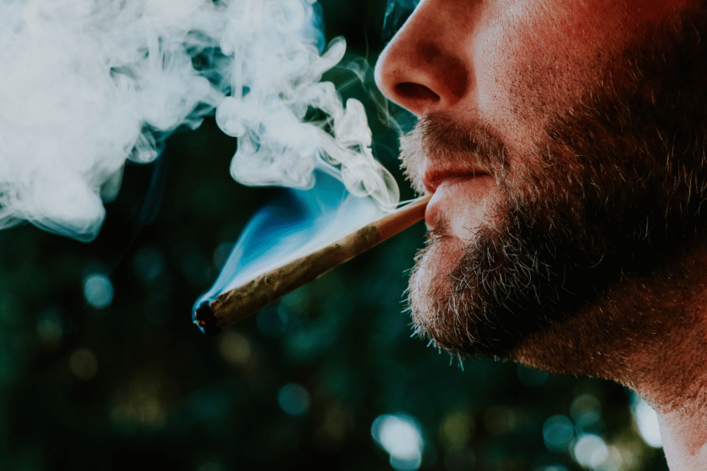 Man smoking a joint outdoors